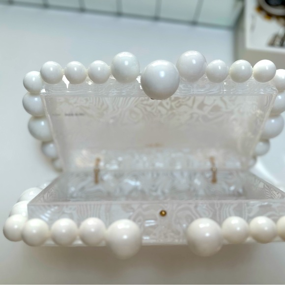 cult gaia Handbags - Box clutch framed by glossy, sculptural baubles.